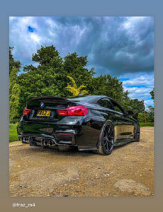 Blacked out BMW M4 with some short tinted 3D gel plates