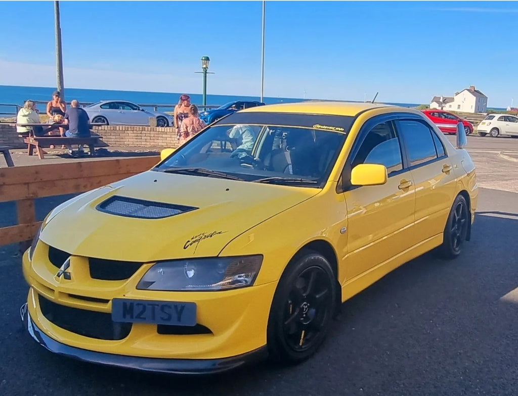 Yellow Mitsubishi Evo 8 with some tinted 3D gel plates