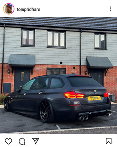 BMW 5 Series with some printed number plates